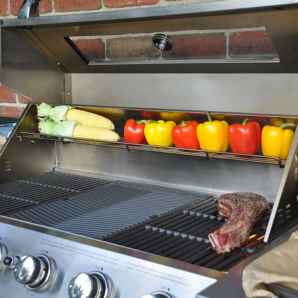 An outdoor alfresco BBQ kitchen with 6-burner hooded gas barbeque 