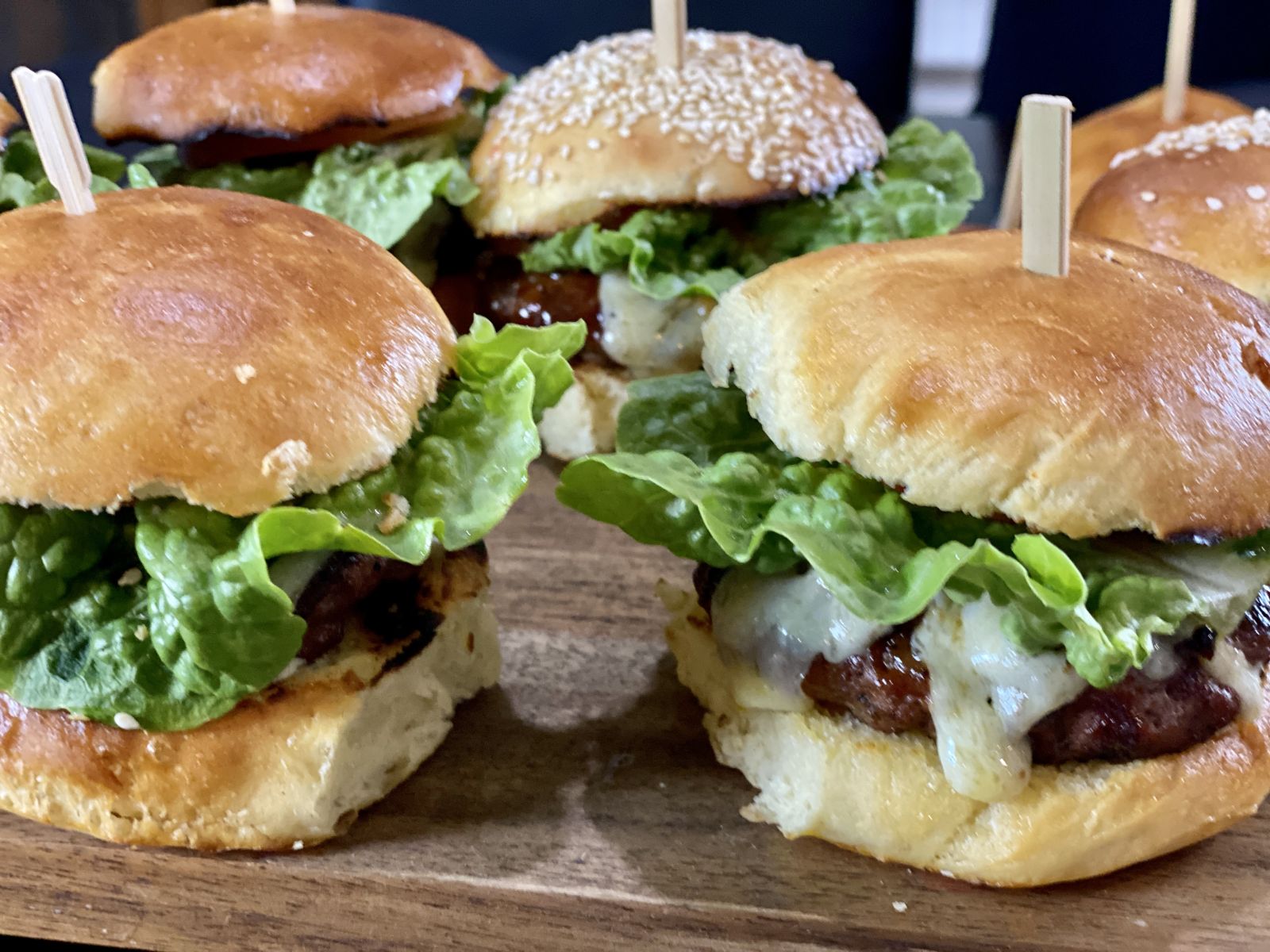 Home made BBQ beef burgers with lettuce and melted cheese