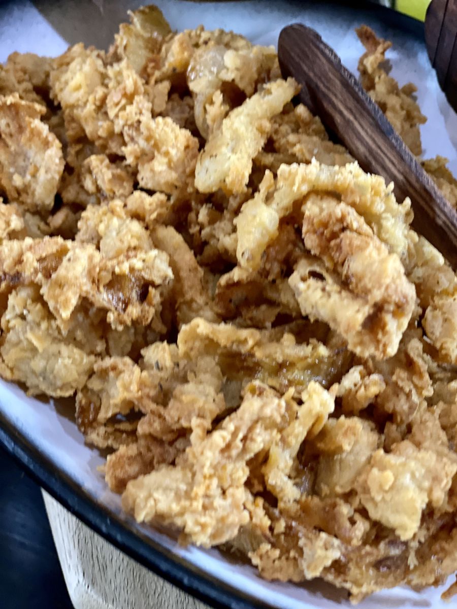 A bowl of crispy onions rings