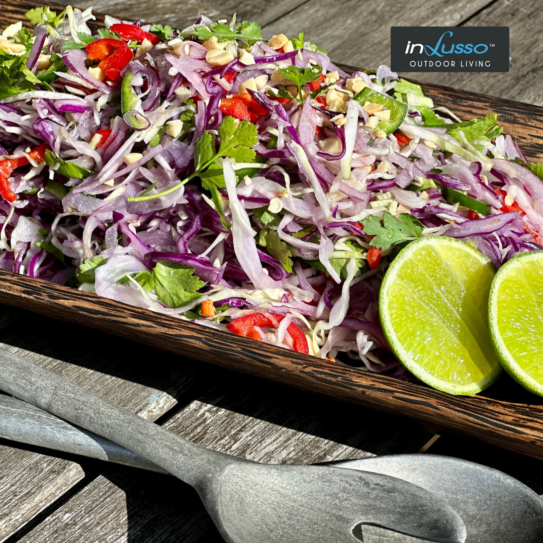 A plate of coleslaw on an outdoor table