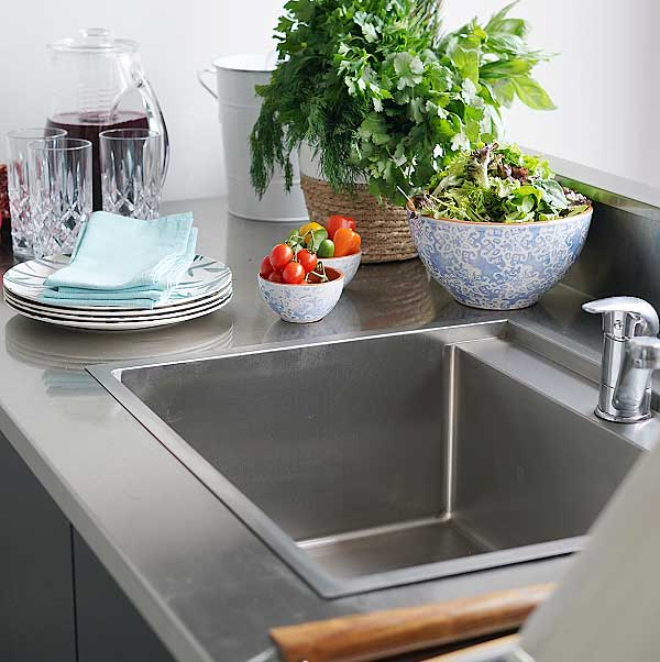 A stainless steel outdoor kitchen with sink and styling ideas