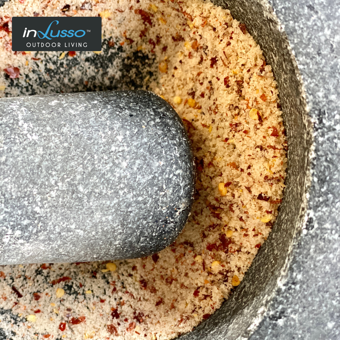 Chilli and salt in a stone mortar and pestle