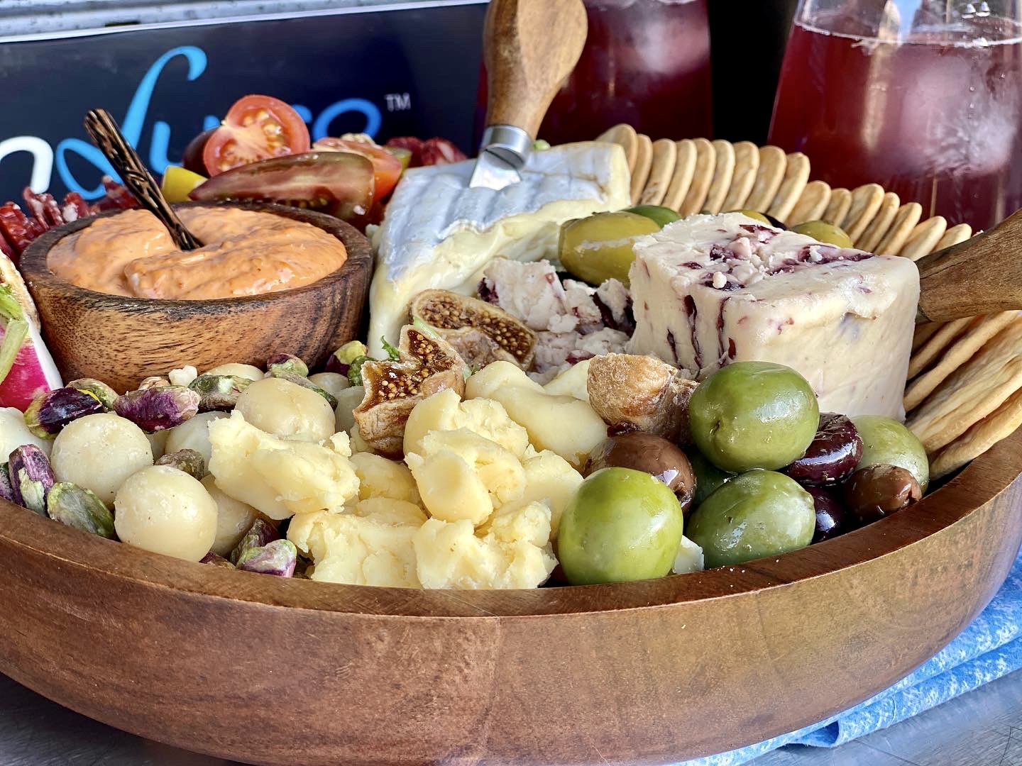 cheese, olives and dips on a platter