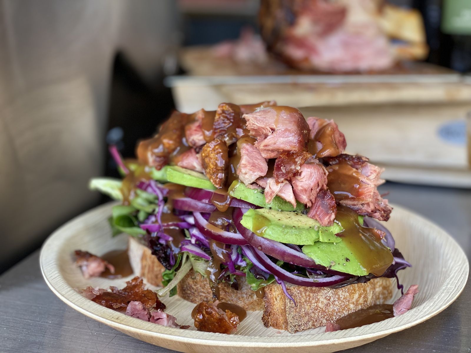 A super sandwich with BBQ pork knuckled and salad