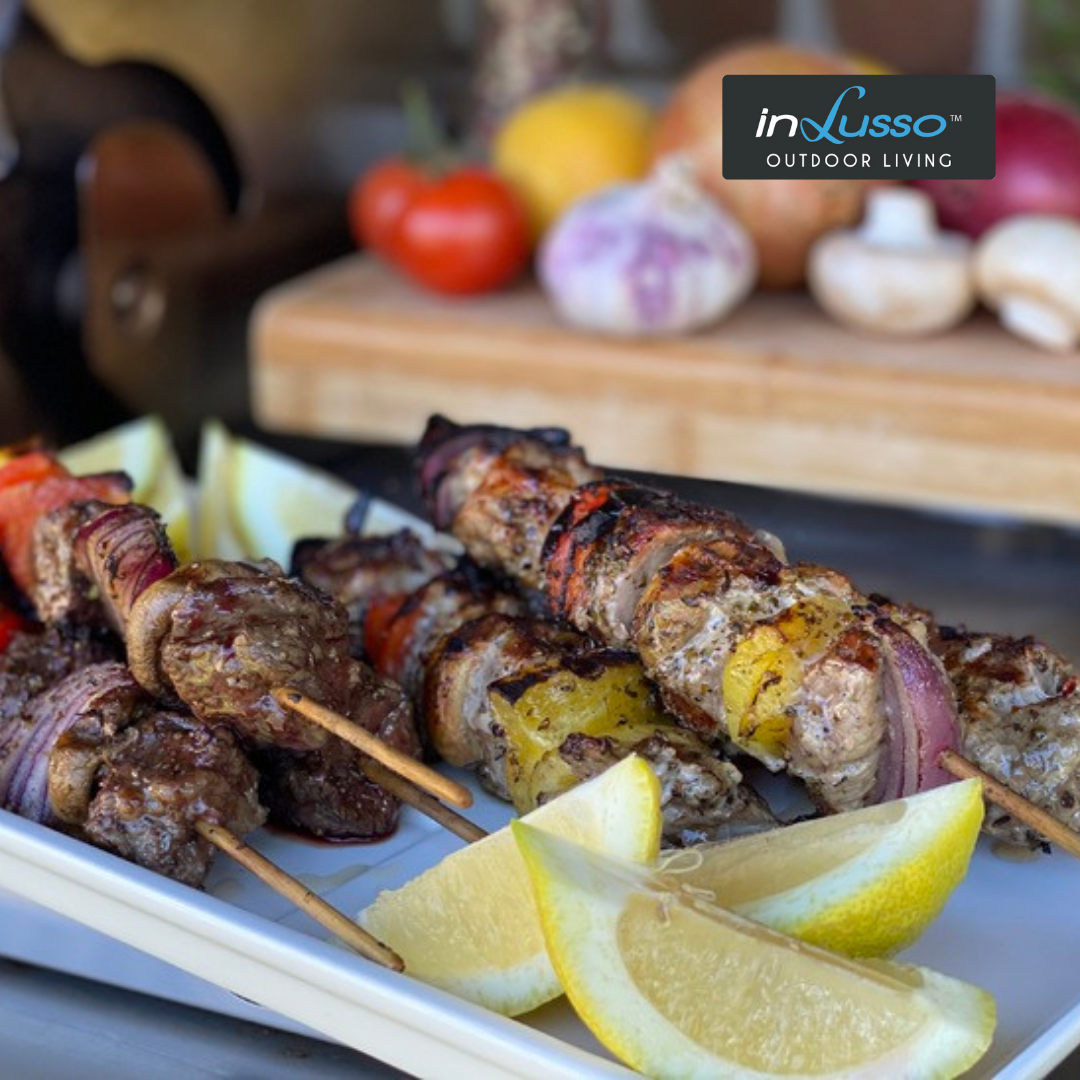 A plate of skewers on an outdoor BBQ kitchen