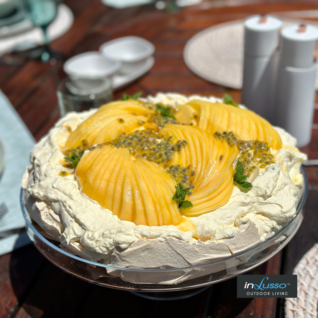 Pavlova with mango and passionfruit topping