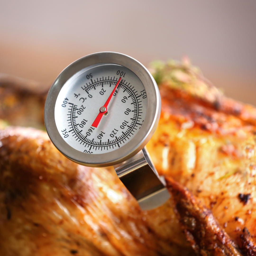 A manual dial meat thermometer