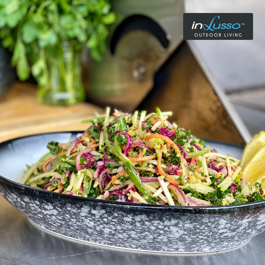 A bowl of coleslaw on an outdoor bbq kitchen