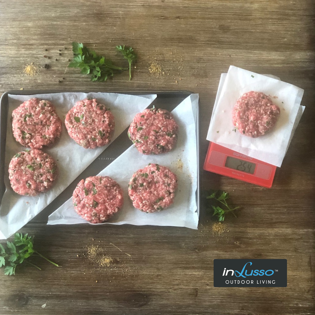 Beef burger patties being shaped and weighed