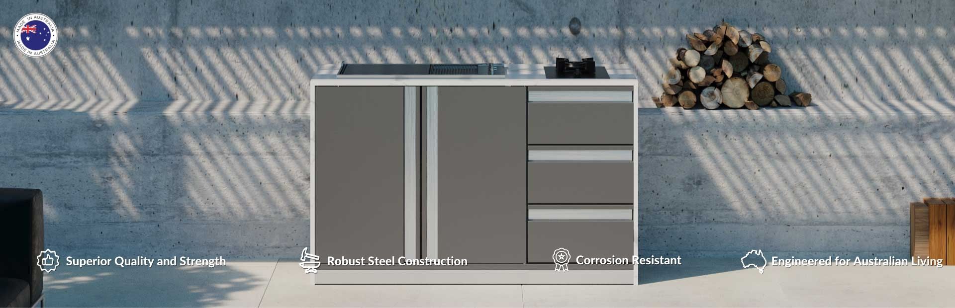 Compact outdoor kitchen with grey double door cabinet, three draws, gas linea BBQ and side burner in an alfresco area.